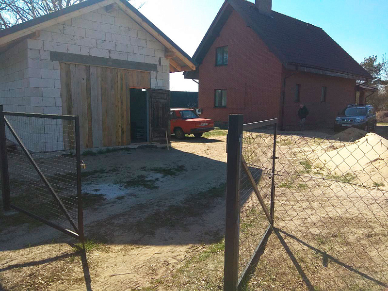 Вентфасад гаража из фасадной доски ДПК Outdoor